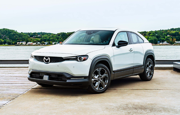 MX-30 EV parked at wood and concrete waterfront pier.