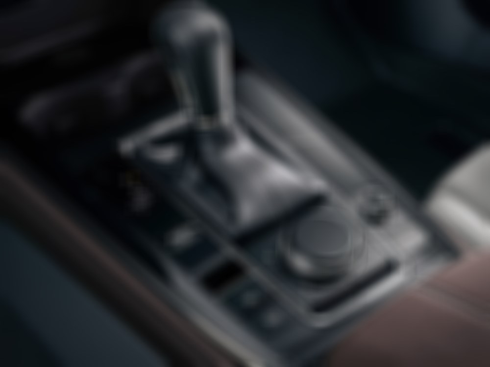 Closeup of CX-30’s centre console with HMI commander controls.  