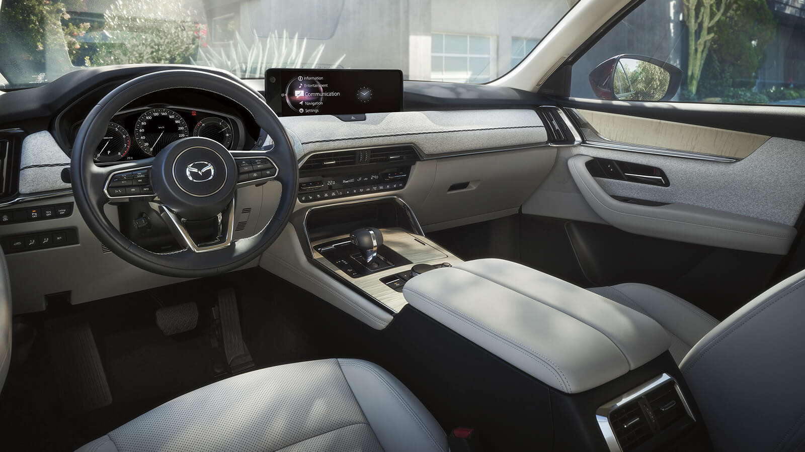 Driver’s seat view of the CX-90's interior and dash. 