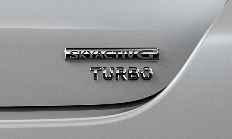 Closeup of Skyactiv-G TURBO badge.