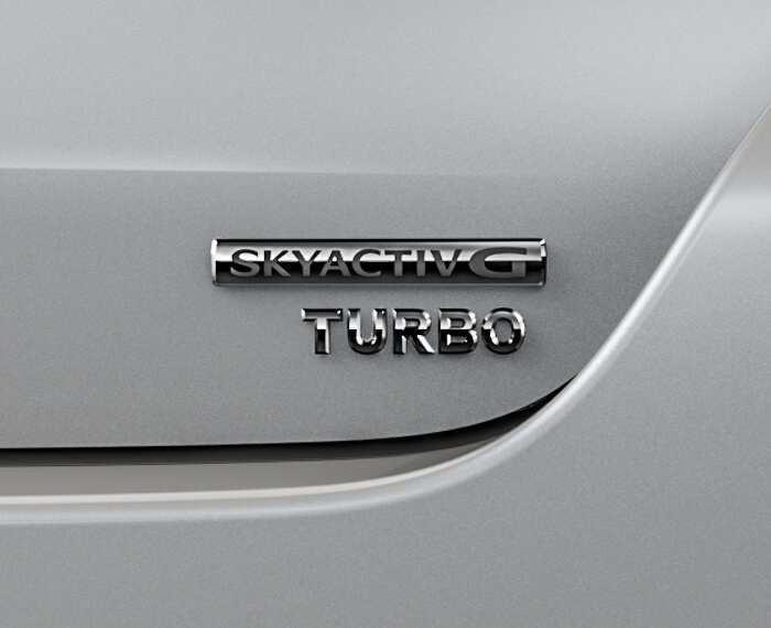 Closeup of Skyactiv-G TURBO badge.