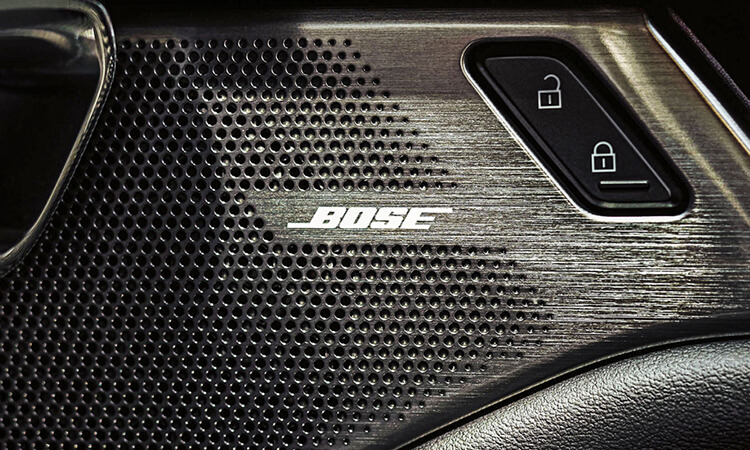 Car speaker with Bose logo.