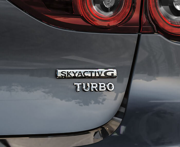 Close up of Skyactiv-G TURBO badge. 