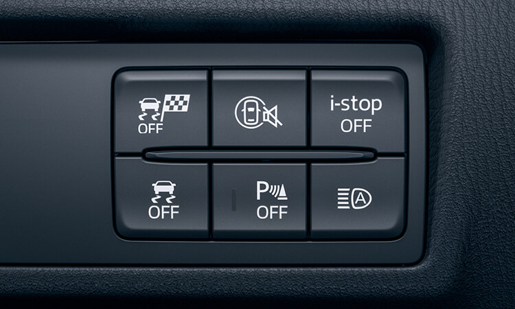 Closeup on a panel of six tactile buttons inside the MX-5.  