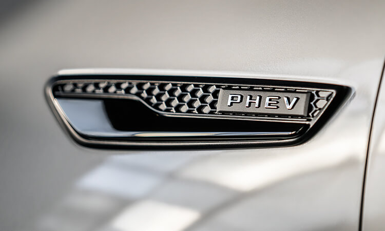 Close up of exterior PHEV badge.